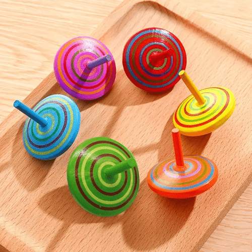 Multicolor wooden spinning tops, 4 cm, for toddlers and kids. Classic toy that boosts hand-eye coordination, concentration, and imaginative play. Safe and durable.